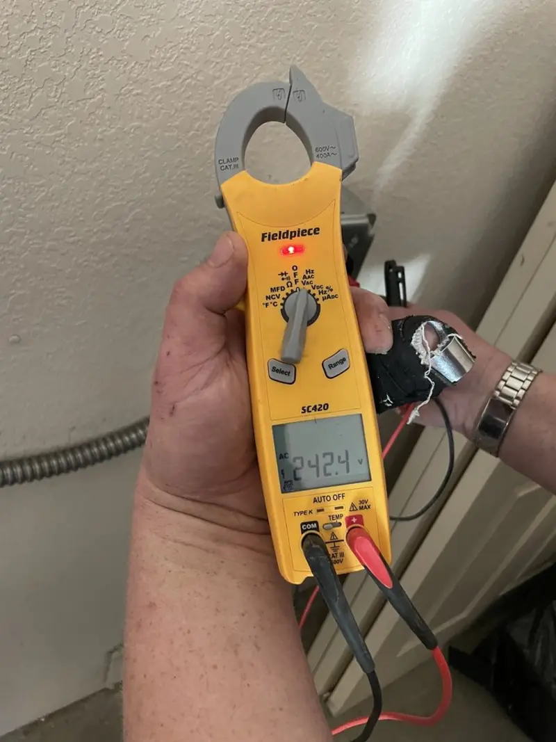 Voltage testing with clamp meter during Circuit Breaker Repair in Westmont